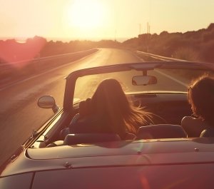 Covertible with the top down driving